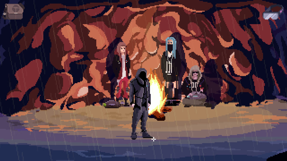 A tribe gathered around a fire in a cave